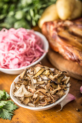 Dried mushrooms sour cabbage smoked pork ribs sausages garlic potatoes and celery herbs