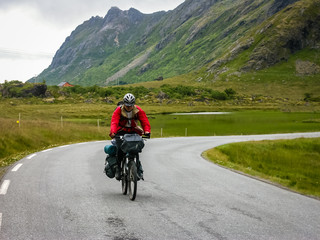 Cyclists travel in the mountains of Norway