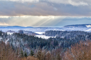 Fototapeta na wymiar Panorama of the winter landscape in the Bavarian Forest in Bavaria, Germany, in dramatic evening light.