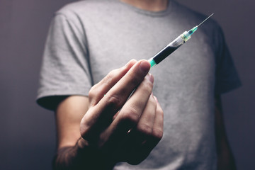 drug addict holding a syringe