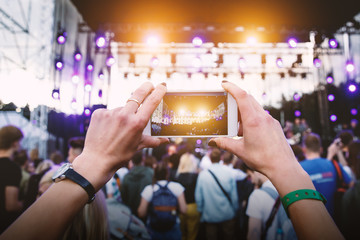Using a mobile phone at outdoor music festival