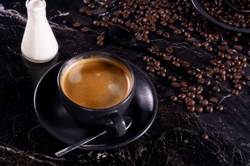 cup of coffee and beans with milk