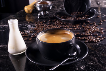cup of coffee and beans with milk
