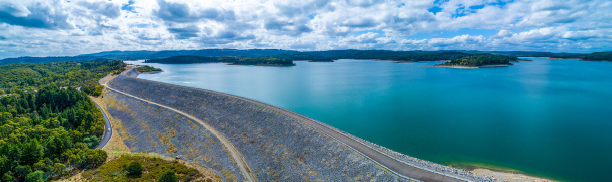 Scenic aerial panorama of Cardinia Reservoir lake and dam wall on overcast day