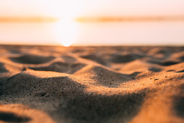 Sunset - dawn on the beach, sand close-up