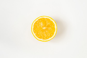 A round slice of lemon, on a white background,