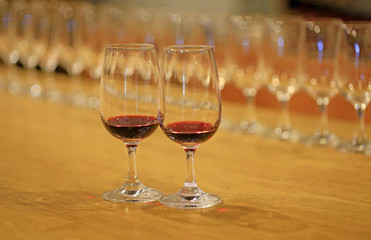 A glass of red wine is on the table