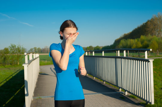 Allergy prevents morning run. Young girl suffers from spring allergens