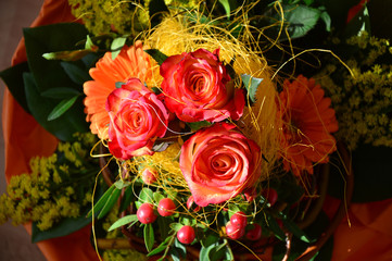 bouquet of roses with gerberas and yellow mimosa,