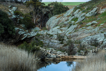 Rocky outcrop with stream