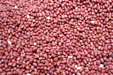 close up on red peanut as food background