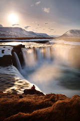 Beautiful scenery of Godafoss waterfall at sunset in Iceland. Godafoss waterfall is famous natural landmark and very popular for photographers and tourists. Attractions and travel concept