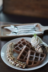 Homemade Belgian waffles with with bananas and ice cream