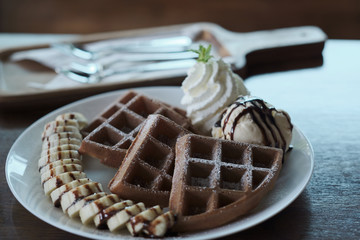 Homemade Belgian waffles with with bananas and ice cream