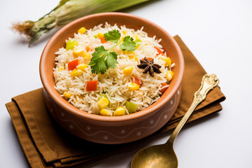 Corn Pilaf or Pulav made using boiled Maize seeds with rice and vegetables. selective focus