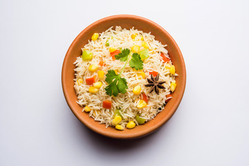Corn Pilaf or Pulav made using boiled Maize seeds with rice and vegetables. selective focus