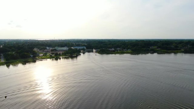 Evening Flight over Lake Ocoee in Central Florida featuring boats, a fountain and an early sunset