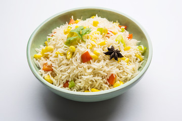 Corn Pilaf or Pulav made using boiled Maize seeds with rice and vegetables. selective focus