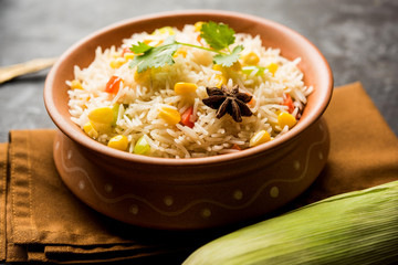 Corn Pilaf or Pulav made using boiled Maize seeds with rice and vegetables. selective focus