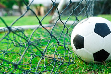 Soccer ball in green field, Soccer ball on grass, vintage style,copy space