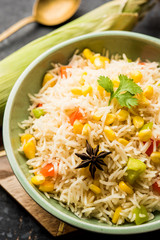 Corn Pilaf or Pulav made using boiled Maize seeds with rice and vegetables. selective focus
