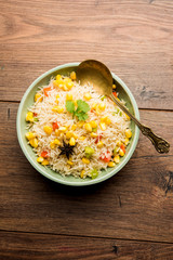 Corn Pilaf or Pulav made using boiled Maize seeds with rice and vegetables. selective focus