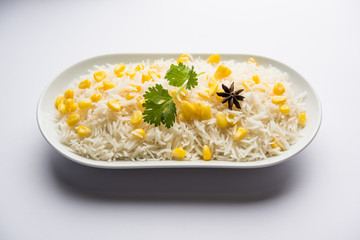 Corn Rice made using boiled Maize seeds with basmati rice, served in a bowl. selective focus 