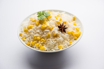 Corn Rice made using boiled Maize seeds with basmati rice, served in a bowl. selective focus 