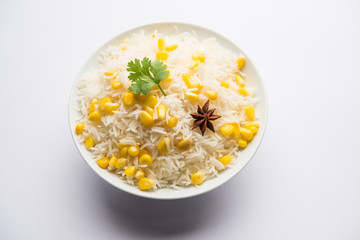 Corn Rice made using boiled Maize seeds with basmati rice, served in a bowl. selective focus 