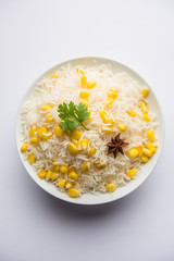 Corn Rice made using boiled Maize seeds with basmati rice, served in a bowl. selective focus 
