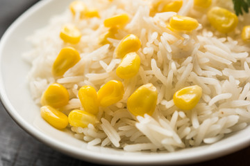Corn Rice made using boiled Maize seeds with basmati rice, served in a bowl. selective focus 