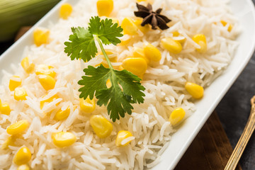 Corn Rice made using boiled Maize seeds with basmati rice, served in a bowl. selective focus 