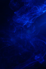 Blue smoke on black background. - 267880061