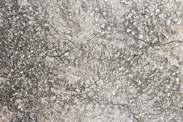 Abstract old dirty dark cement wall background on ground texture.