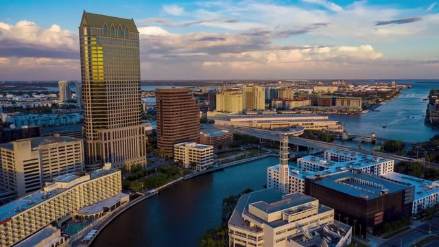 Aerial timelapse of the Riverwalk in Tampa with the city skyline at sunset.