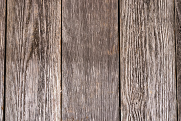 Faded wood grain background.