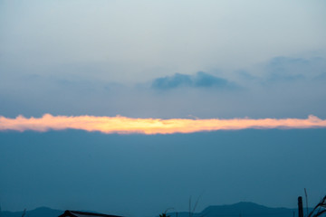 Sunset sky clouds above the roof, nature background, Clouds sky at dawn