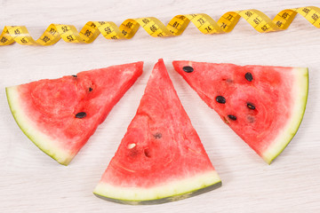 Watermelon and centimeter, concept of healthy nutrition, slimming and fruit containing minerals