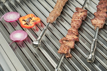 Kitchen electric grill with stones for the network catering. Professional kitchen equipment