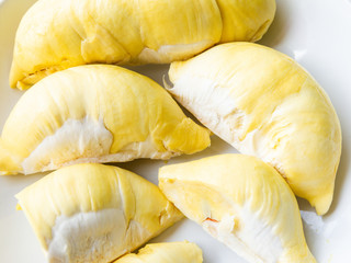 Close up durian flesh yellow gold Bright yellow tropical fruit. durian fruit in season tropics