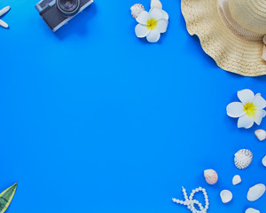 summer traveler beach accessories on blue background