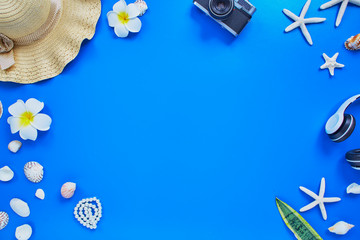 summer traveler beach accessories on blue background