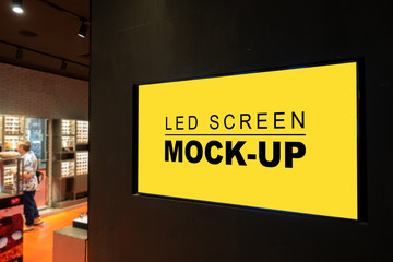 Mock up horizontal advertising LED Screen at eyeglass shop