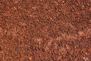 The dirt road that is crushed with brown gravel