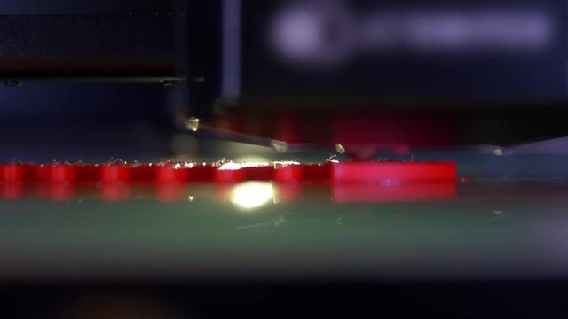 3D printer working close up. Automatic three dimensional 3d printer performs plastic. Modern 3D printer printing an object from the hot molten. Concept progressive additive technology for 3d printing