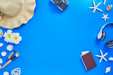 summer traveler beach accessories on blue background