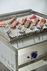 Kitchen electric grill with stones for the network catering. Professional kitchen equipment