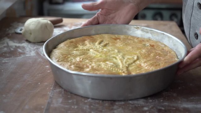 Preparation of stuffed pizza with escarole, olives and passed to the oven, neapolitan food in Christmas and Easter Time