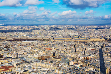 Fototapeta premium Paris cityscape. Aerial view of Palais du Louvre, seen from the Montparnasse skyscraper