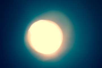 Ray of lamp spot lens light over black background, square stage abstract illumination